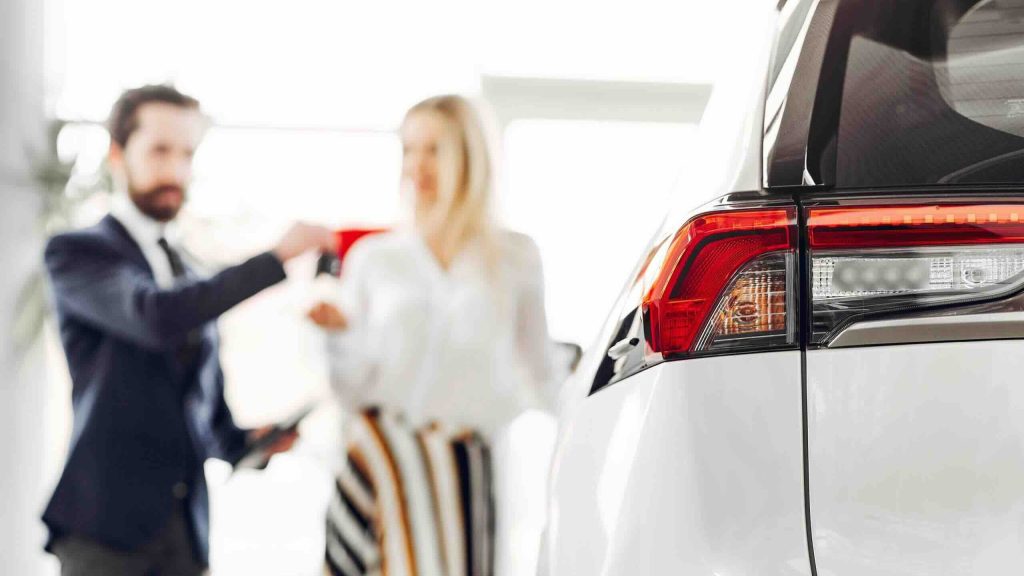 Car handover process at a Dubai dealership highlighting final tips for buying a car in Dubai safely and confidently.